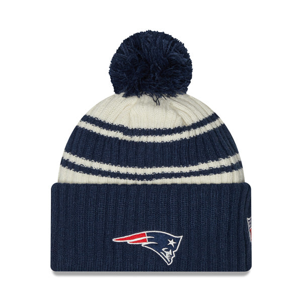 New England Patriots New Era 2022 Sideline Sport Cuffed Pom Knit Hat - Cream/Navy