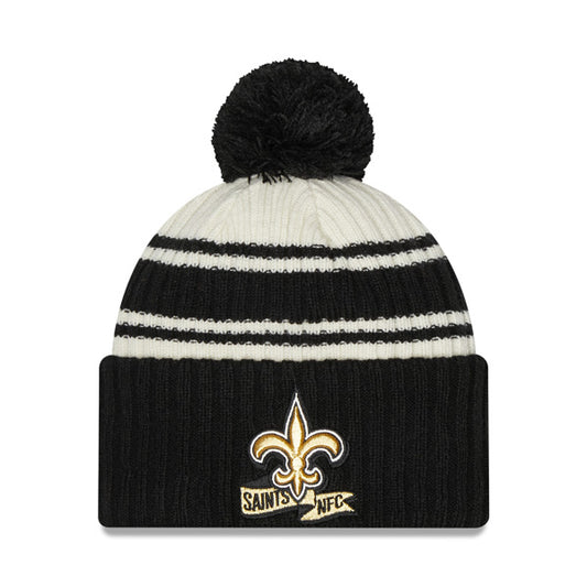 New Orleans Saints New Era 2022 Sideline Sport Cuffed Pom Knit Hat - Cream/Black