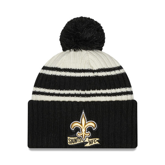 New Orleans Saints New Era 2022 Sideline Sport Cuffed Pom Knit Hat - Cream/Black