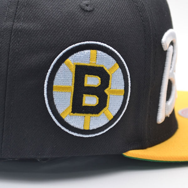 Boston Bruins Mitchell & Ness NHL VINTAGE SCRIPT Snapback Adjustable Hat -Black/Yellow